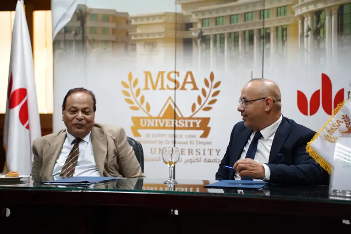 Eng. Mahmoud Nouh and the MSA University representative at the signing table